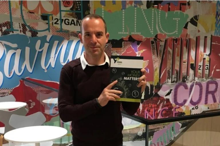 Martin Lewis holding money matters textbook