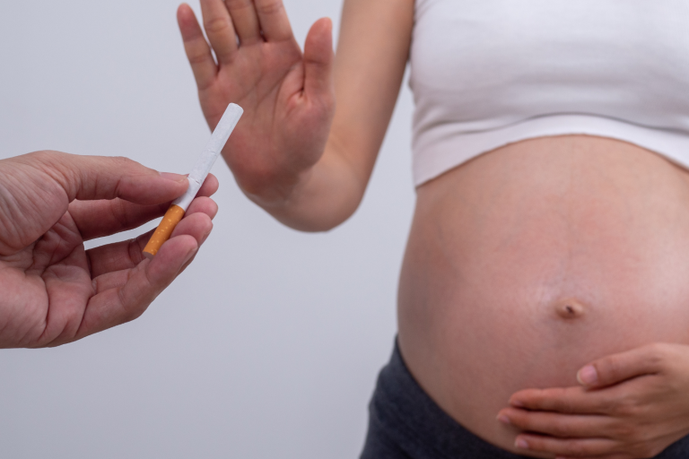 Pregnant women refusing a cigarette