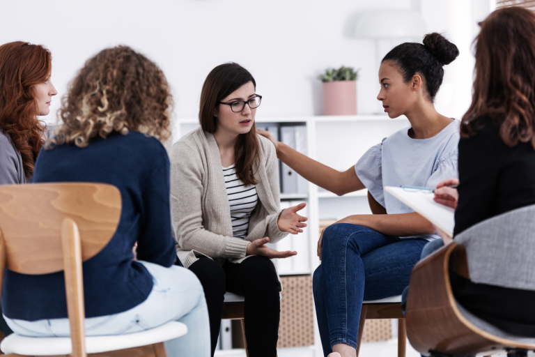 women's support group sitting and talking