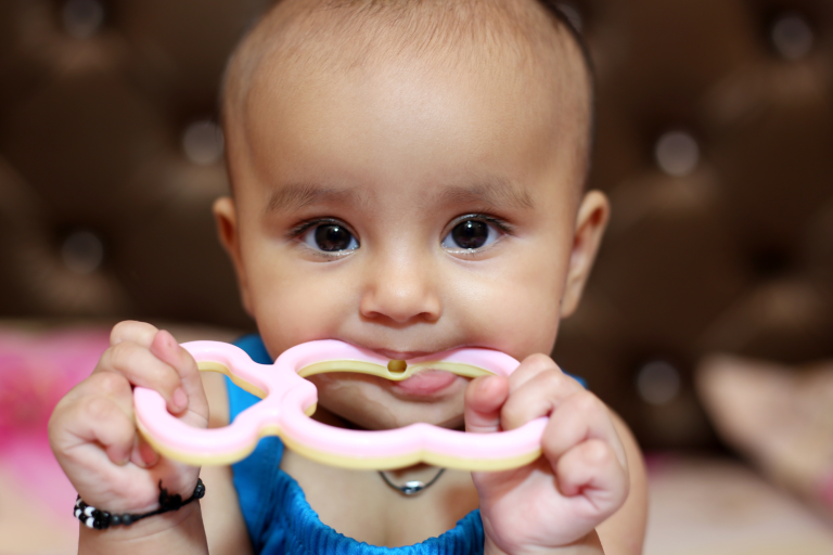 baby with teething ring