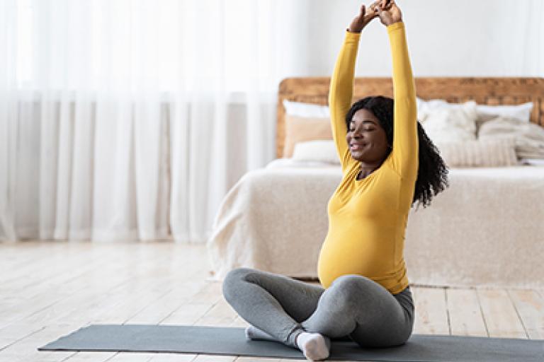 pregnant lady doing yoga