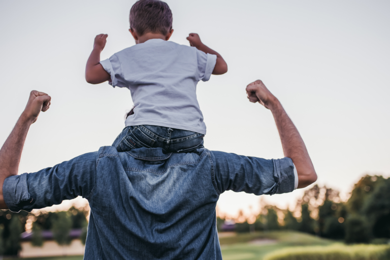 Dad with young boy on his shoulders