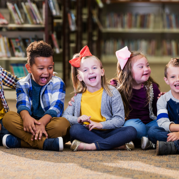 Children sitting on floor in library